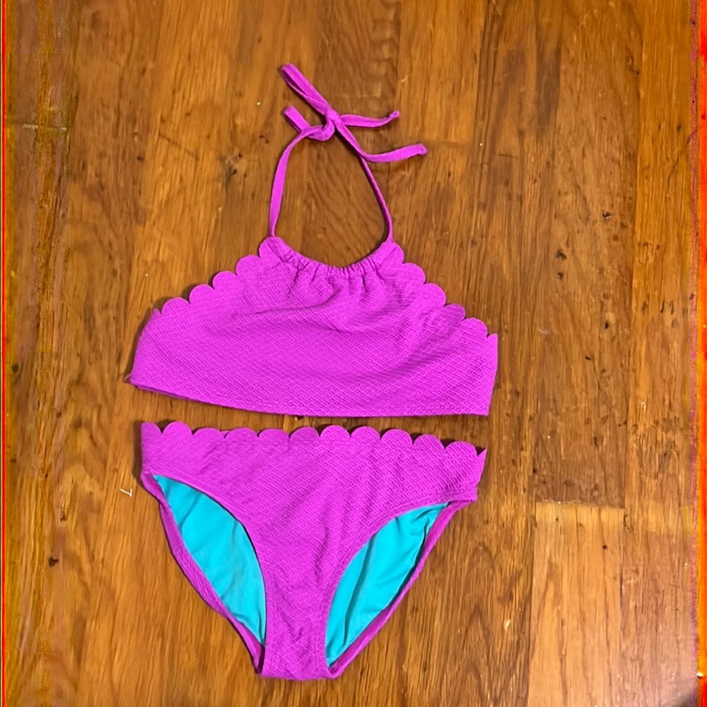 Jessica Simpson two piece bathing suit with scalloped edge details.